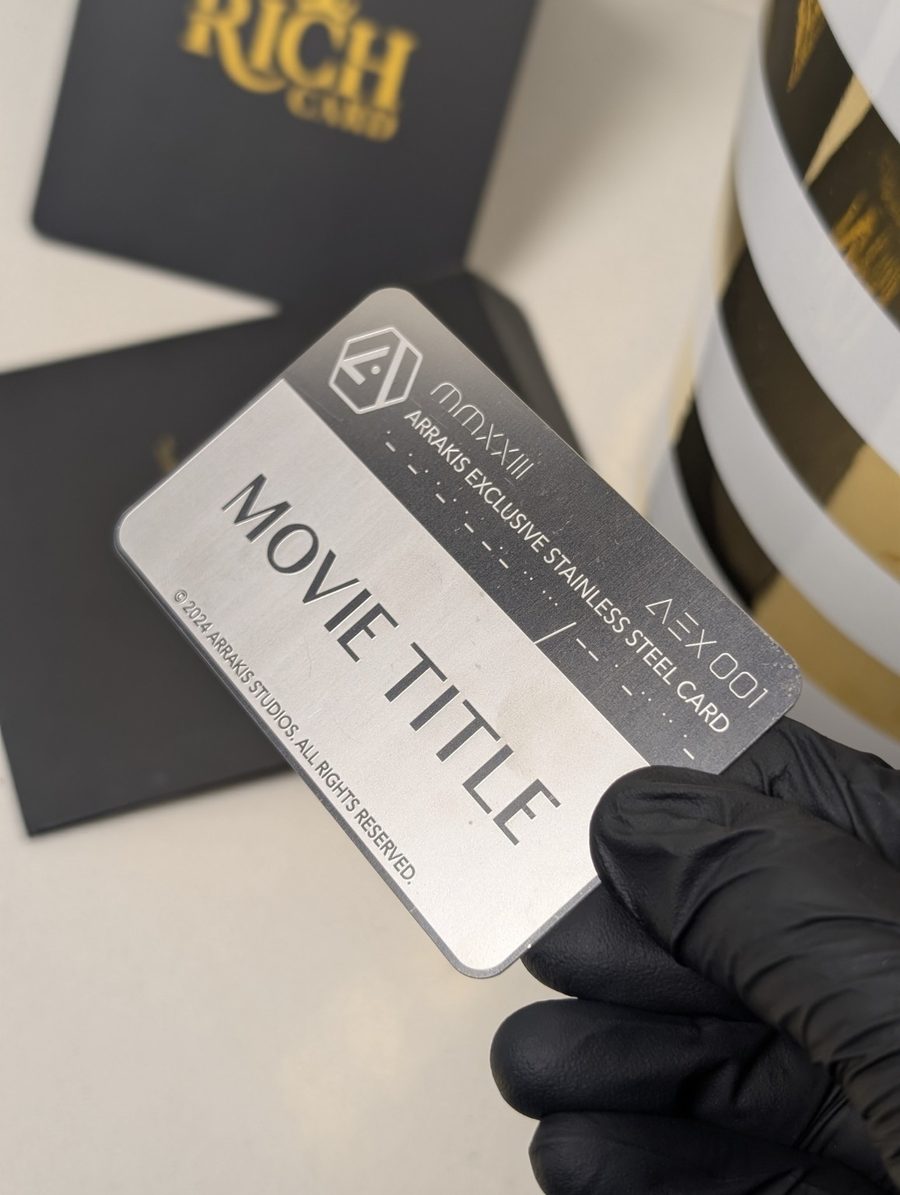 Silver-tone ARRAKIS metal card with engraved title layout