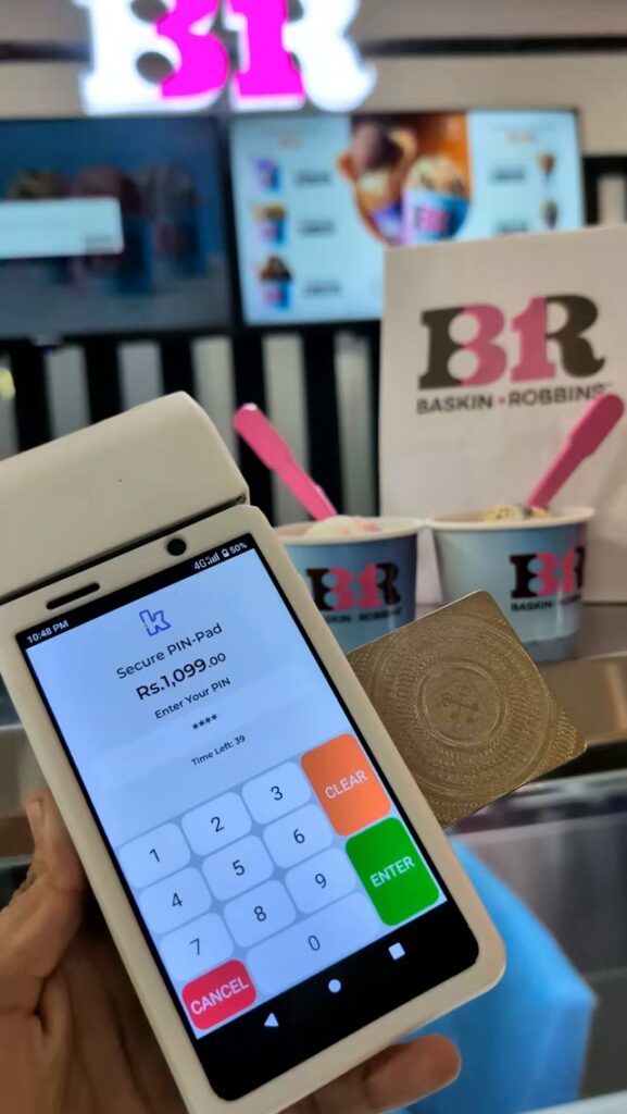 Paying in a shop with our metal card