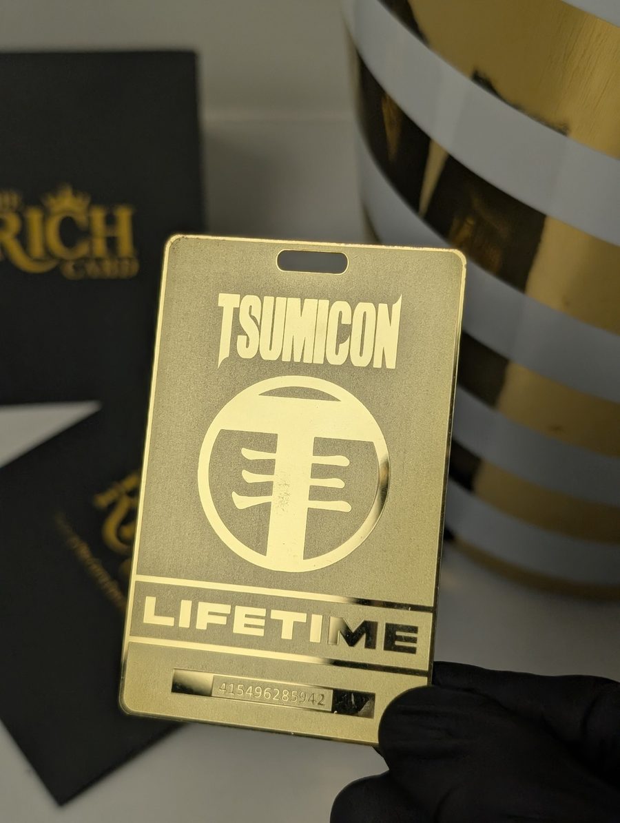 TSUMICON lifetime metal membership pass with gold-tone finish and lanyard slot